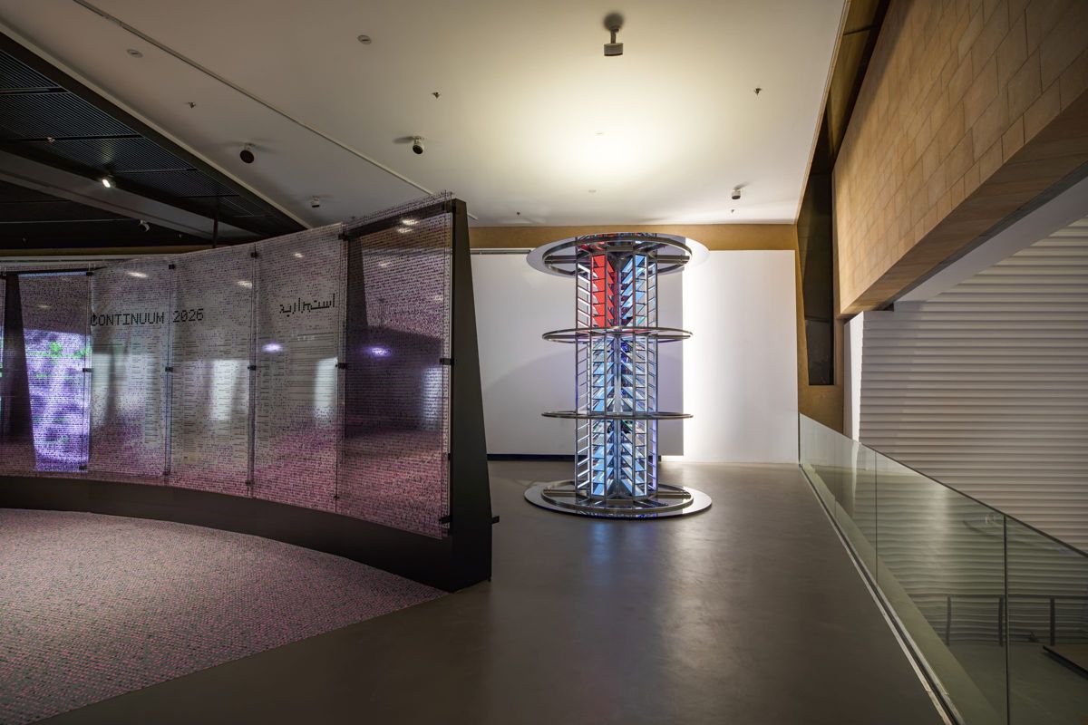 Installation view of the tower of screens in the exhibition hall.